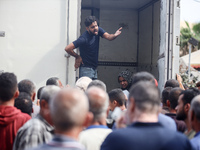 Palestinians are mourning their relatives, killed in an Israeli strike, at the Al-Aqsa Martyrs hospital in Deir el-Balah in the central Gaza...