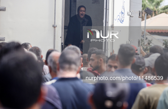 Palestinians are mourning their relatives, killed in an Israeli strike, at the Al-Aqsa Martyrs hospital in Deir el-Balah in the central Gaza...