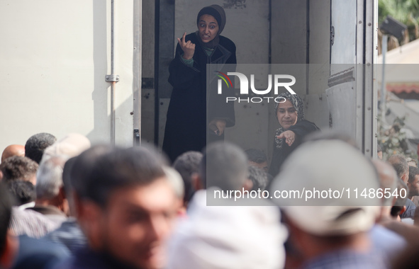 Palestinians are mourning their relatives, killed in an Israeli strike, at the Al-Aqsa Martyrs hospital in Deir el-Balah in the central Gaza...