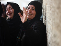 Palestinians are mourning their relatives, killed in an Israeli strike, at the Al-Aqsa Martyrs hospital in Deir el-Balah in the central Gaza...