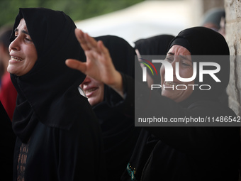 Palestinians are mourning their relatives, killed in an Israeli strike, at the Al-Aqsa Martyrs hospital in Deir el-Balah in the central Gaza...