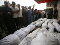 Palestinians are mourning their relatives, killed in an Israeli strike, at the Al-Aqsa Martyrs hospital in Deir el-Balah in the central Gaza...