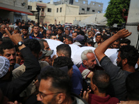 Palestinians are mourning their relatives, killed in an Israeli strike, at the Al-Aqsa Martyrs hospital in Deir el-Balah in the central Gaza...