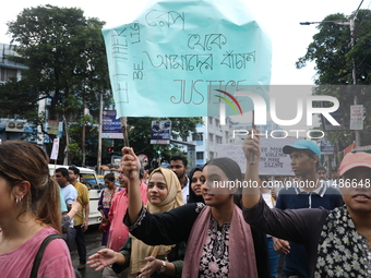 Medical professionals are holding placards and shouting slogans during a nationwide strike by doctors in a protest march against the recent...