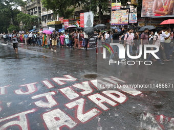 Medical professionals are holding placards and shouting slogans during a nationwide strike by doctors in a protest march against the recent...