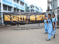 Students are walking past a closed entry gate in front of the R G Kar Medical College and Hospital after the recent rape and murder of a PGT...