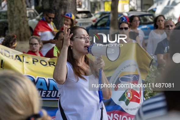 Activists are carrying banners and placards and shouting political slogans during a rally in Praca de Restauradores in Lisbon, Portugal, on...