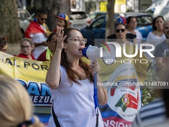 Activists are carrying banners and placards and shouting political slogans during a rally in Praca de Restauradores in Lisbon, Portugal, on...