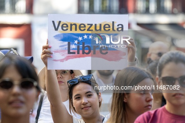 Activists are carrying banners and placards and shouting political slogans during a rally in Praca de Restauradores in Lisbon, Portugal, on...