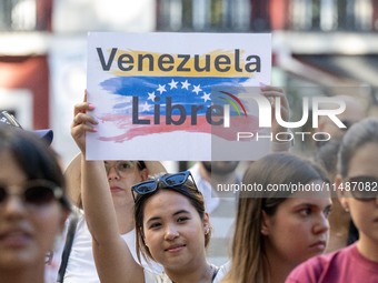 Activists are carrying banners and placards and shouting political slogans during a rally in Praca de Restauradores in Lisbon, Portugal, on...