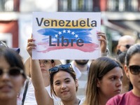 Activists are carrying banners and placards and shouting political slogans during a rally in Praca de Restauradores in Lisbon, Portugal, on...