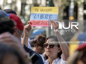 Activists are carrying banners and placards and shouting political slogans during a rally in Praca de Restauradores in Lisbon, Portugal, on...