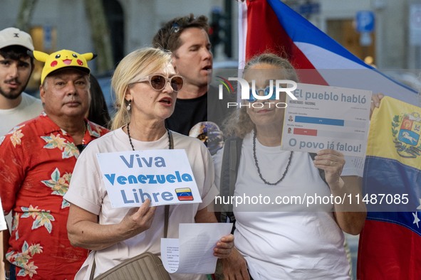 Several activists are carrying flags and banners and shouting political slogans during a rally in Praca de Restauradores in Lisbon, Portugal...