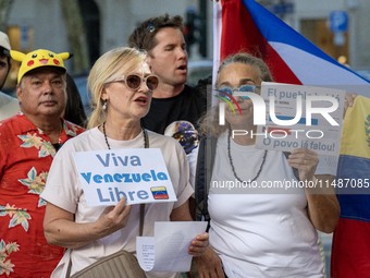 Several activists are carrying flags and banners and shouting political slogans during a rally in Praca de Restauradores in Lisbon, Portugal...