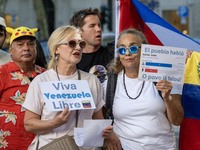 Several activists are carrying flags and banners and shouting political slogans during a rally in Praca de Restauradores in Lisbon, Portugal...