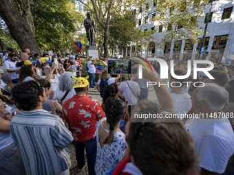 Several activists are carrying flags and banners and shouting political slogans during a rally in Praca de Restauradores in Lisbon, Portugal...