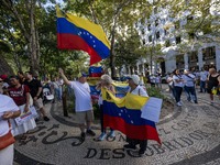 Several activists are carrying flags and banners and shouting political slogans during a rally in Praca de Restauradores in Lisbon, Portugal...