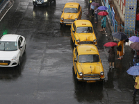 Yellow ambassador taxis are waiting for customers following heavy monsoon rains in Kolkata, West Bengal, India, on August 17, 2024. (