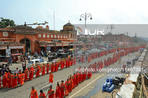 Hindu women devotees are carrying holy water as they take part in a 'Kalash Yatra' during the holy month of 'Sharvan', in Jaipur, Rajasthan,...