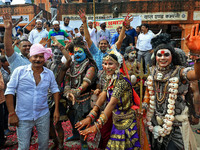 Artists are dressing up and performing during the 'Kalash Yatra' in the holy month of 'Sharvan', in Jaipur, Rajasthan, India, on August 17,...