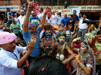 Artists are dressing up and performing during the 'Kalash Yatra' in the holy month of 'Sharvan', in Jaipur, Rajasthan, India, on August 17,...