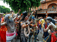 Artists are dressing up and performing during the 'Kalash Yatra' in the holy month of 'Sharvan', in Jaipur, Rajasthan, India, on August 17,...