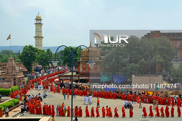 Hindu women devotees are carrying holy water as they take part in a 'Kalash Yatra' during the holy month of 'Sharvan', in Jaipur, Rajasthan,...