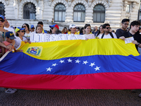 People take part in a protest called by the Venezuelan opposition for election 'victory' to be recognised in Porto, Portugal, on August 17,...