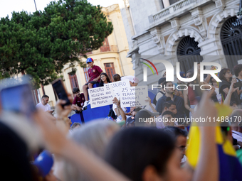 People take part in a protest called by the Venezuelan opposition for election 'victory' to be recognised in Porto, Portugal, on August 17,...