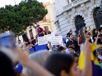 People take part in a protest called by the Venezuelan opposition for election 'victory' to be recognised in Porto, Portugal, on August 17,...