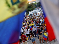 People take part in a protest called by the Venezuelan opposition for election 'victory' to be recognised in Porto, Portugal, on August 17,...