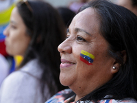 People take part in a protest called by the Venezuelan opposition for election 'victory' to be recognised in Porto, Portugal, on August 17,...