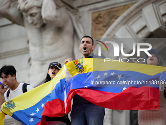 People take part in a protest called by the Venezuelan opposition for election 'victory' to be recognised in Porto, Portugal, on August 17,...