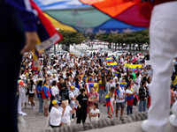 People take part in a protest called by the Venezuelan opposition for election 'victory' to be recognised in Porto, Portugal, on August 17,...