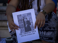 A person is holding a banner during a rally at Commerce Square in Lisbon, Portugal, on August 17, 2024. Opponents to the regime of Venezuela...