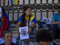 A person is holding a banner during a rally at Commerce Square in Lisbon, Portugal, on August 17, 2024. Opponents to the regime of Venezuela...