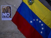 A person is holding a Venezuelan flag during a rally in Lisbon, Portugal, on August 17, 2024, at Commerce Square. Opponents to the regime of...