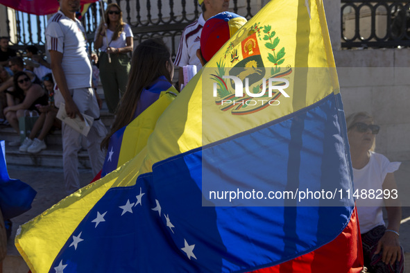 Members of the Venezuelan community are protesting the recent election results in Venezuela during a rally at Commerce Square in Lisbon, Por...