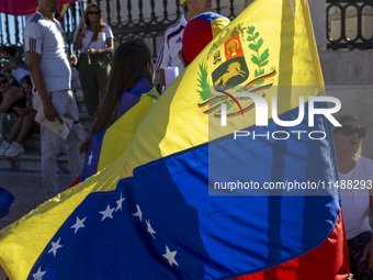 Members of the Venezuelan community are protesting the recent election results in Venezuela during a rally at Commerce Square in Lisbon, Por...