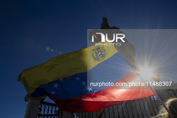 Members of the Venezuelan community are protesting the recent election results in Venezuela during a rally at Commerce Square in Lisbon, Por...