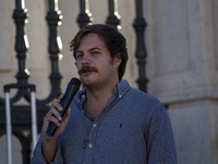 A person is talking with a microphone during a rally at Commerce Square in Lisbon, Portugal, on August 17, 2024. Opponents to the regime of...