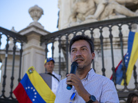 Tiago Mayan is talking to the Venezuelan community during a rally at Commerce Square in Lisbon, Portugal, on August 17, 2024. Opponents to t...