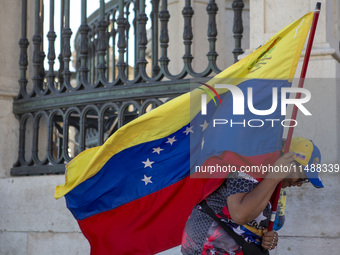 Members of the Venezuelan community are protesting the recent election results in Venezuela during a rally at Commerce Square in Lisbon, Por...