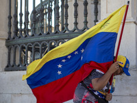 Members of the Venezuelan community are protesting the recent election results in Venezuela during a rally at Commerce Square in Lisbon, Por...