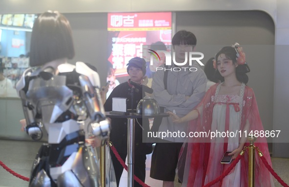 An intelligent bionic ''beauty'' robot is performing and interacting with citizens to answer questions at a shopping mall in Hangzhou, China...