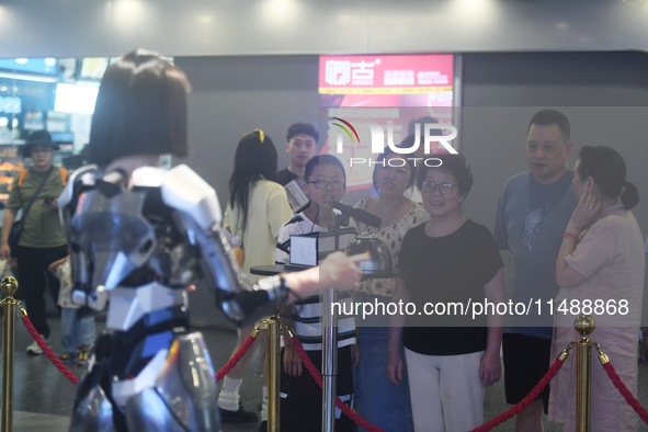 An intelligent bionic ''beauty'' robot is performing and interacting with citizens to answer questions at a shopping mall in Hangzhou, China...