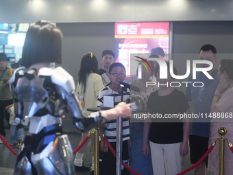 An intelligent bionic ''beauty'' robot is performing and interacting with citizens to answer questions at a shopping mall in Hangzhou, China...