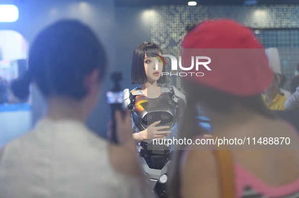 An intelligent bionic ''beauty'' robot is performing and interacting with citizens to answer questions at a shopping mall in Hangzhou, China...