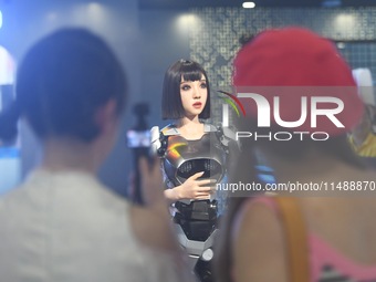 An intelligent bionic ''beauty'' robot is performing and interacting with citizens to answer questions at a shopping mall in Hangzhou, China...