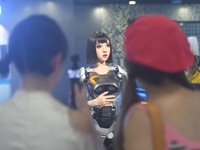 An intelligent bionic ''beauty'' robot is performing and interacting with citizens to answer questions at a shopping mall in Hangzhou, China...